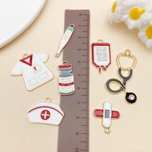 Detailed macro view of 7 colorful medical enamel charms including doctor uniform and stethoscope