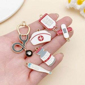 Detail of medical enamel charms including stethoscope and nurse cap for DIY bracelets