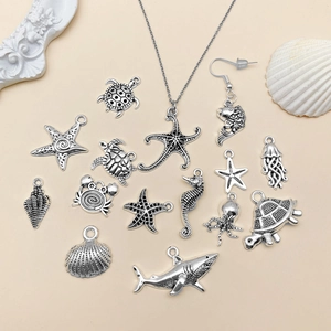 Antique silver ocean jewelry charms set featuring starfish, seahorse, and shark pendants