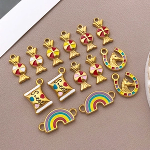 Macro detail of colorful enamel stainless steel rainbow and sweet candy jewelry pendants