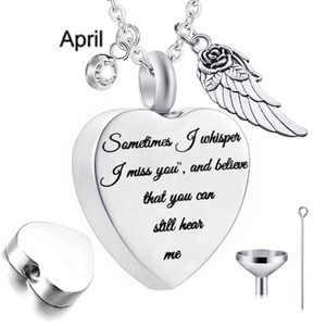 Detail view of heart-shaped cremation pendant with angel wing and April birthstone kit