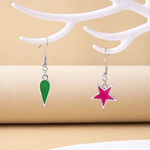 Anime Hisoka star and teardrop earrings on a white branch display stand