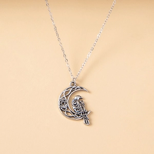Vintage crescent moon and crow pendant necklace with Celtic knot and pentagram in antique silver