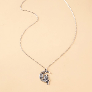 Vintage silver owl necklace featuring a crescent moon with Celtic knots and star pendant