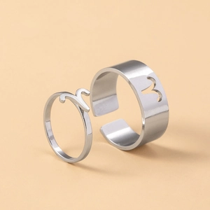 Detail view of silver Aries constellation couple rings with adjustable open band design