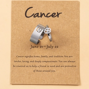 Cancer zodiac ring set with open band and charm on a kraft display card