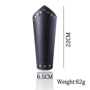 Close-up of black leather wrist guard with orange stitching, rivets and dimensions