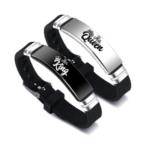 Close-up of His Queen and Her King crown engravings on silicone stainless steel bracelets