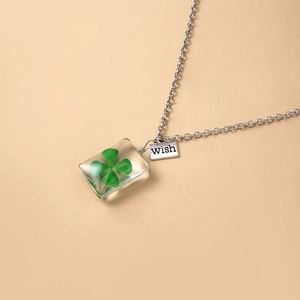 Clear resin rectangle pendant necklace with real dried four leaf clover and wish tag
