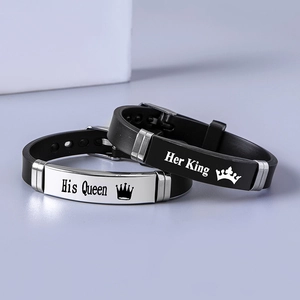 Detail of His Queen and Her King crown engravings on silicone couple bracelets