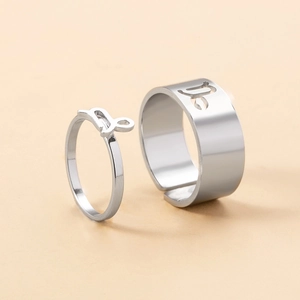 Detailed macro view of Capricorn zodiac sign on adjustable couple rings in stainless steel