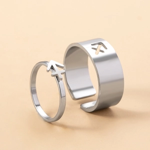 Detail of silver stainless steel Sagittarius zodiac rings for couples in vintage style