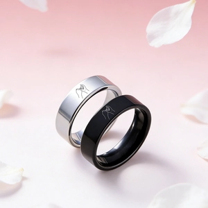 Detailed view of black and silver crown bracelets with promises hand engraving patterns