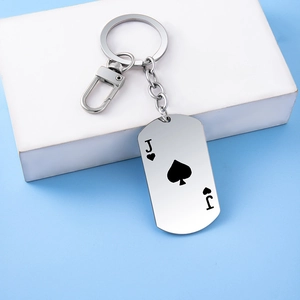 Macro shot of stainless steel dog tag keychain with Jack of Spades mirror finish
