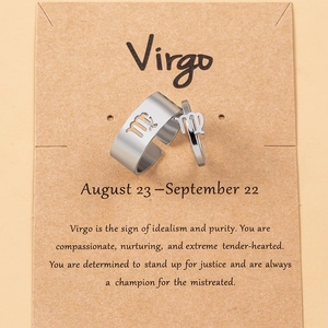 Detail of Virgo zodiac ring set on kraft card with silver open adjustable bands