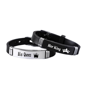 Matching couple bracelets with Her King His Queen crowns on black silicone band