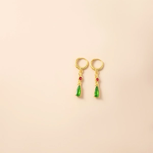Detail shot of Anime Howl's Moving Castle green teardrop earrings with golden hooks