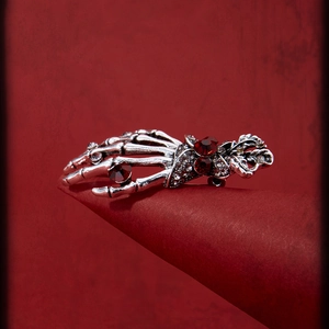 Gothic silver skeletal hand brooch with red rhinestones for Halloween costume decoration