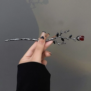 Gothic silver-black branch hair stick featuring a deep red rosebud and dark leaves