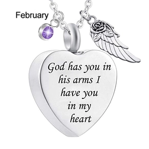 Detail of heart pendant with February birthstone and angel wing on silver chain