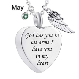Detail of heart urn pendant with angel wing and May birthstone on a steel chain