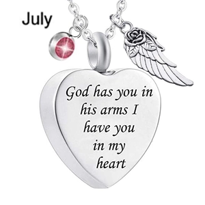 Detail of silver heart locket necklace with angel wing and July pink birthstone