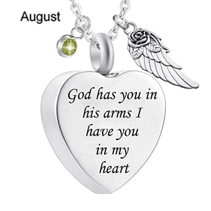 Close-up of heart locket with angel wing, August birthstone, and engraved text