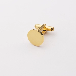 Macro shot of polished gold round stainless steel cufflinks with secure T-bar closure