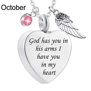 Detailed view of October birthstone heart pendant with wings on stainless steel chain