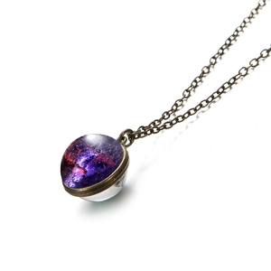 Vintage bronze galaxy pendant necklace with a round purple nebula glass dome and chain