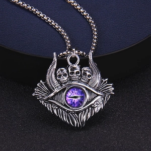 Macro shot of gothic skull pendant with purple devil's eye and intricate metal details