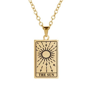 Close-up of golden tarot pendant featuring the sun design and O-chain necklace