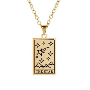 Macro detail of gold stainless steel Tarot The Star pendant with polished finish