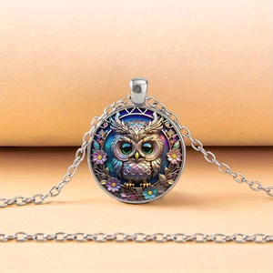 Silver owl glass gem necklace with purple flowers on a soft pink background
