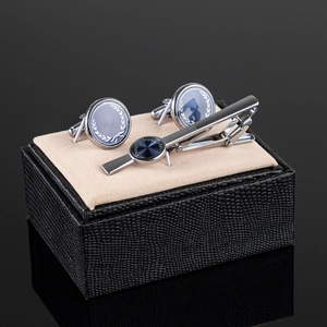 Silver mens cufflinks and tie clip set with blue laurel wreath pattern on black leather