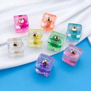 Mix of 8 glowing resin cube pendants with real dried flowers and golden metal loops