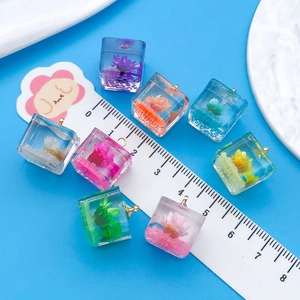 Detailed view of colorful resin flower cube charms with ruler showing 1.2cm size