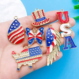 Detail view of 6 USA Independence Day themed charms with red white and blue enamel