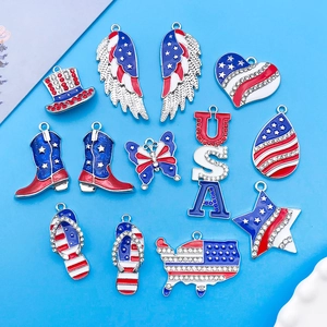 Patriotic USA charms set with red, white, and blue enamel and rhinestones on blue background