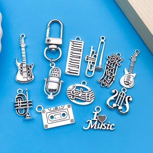 Set di ciondoli musicali in argento vintage con chitarra e sassofono per gioielli DIY