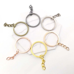 Detailed view of metal key rings with chains in six distinct metallic plating finishes