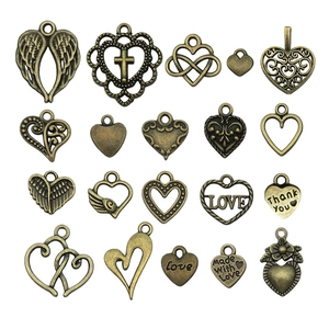 Set van 20 vintage bronzen hartvormige hangers met holle gravures voor DIY-sieraden