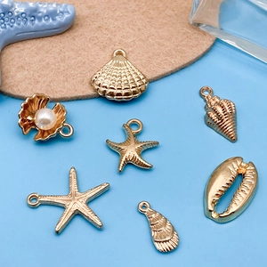 7Pcs gold ocean theme charms set with starfish and seashell pendants for DIY jewelry