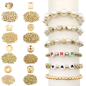 Golden DIY jewelry spacer bead set featuring hearts stars and spheres for bracelets