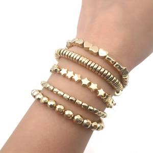 Five-piece set of golden fashion bracelets with heart, star, and geometric beads