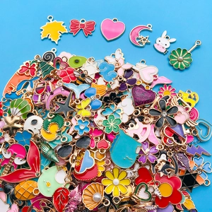 Detailed top view of assorted colorful enamel alloy charms for DIY jewelry making kits