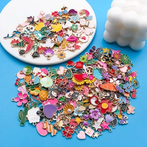 Macro shot of colorful enamel alloy charms for DIY jewelry making in various shapes