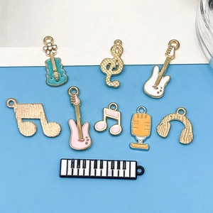 Mix of colorful musical instrument charms with guitar piano and notes for DIY jewelry