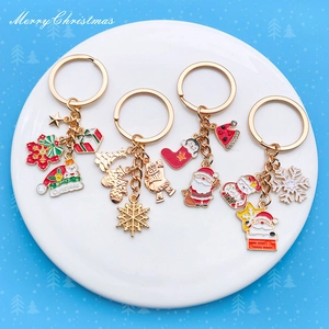 Set of 4 Christmas enamel metal keychains with Santa Claus, snowmen and tree charms