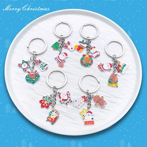 6-piece Christmas keychain set featuring colorful Santa and Reindeer enamel pendants